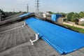 Tarpaulins on roofs