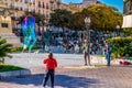 TARRAGONA, SPAIN, DECEMBER 29, 2015: a group of street performers is making soap bubbles in order to amuse people