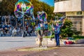 TARRAGONA, SPAIN, DECEMBER 29, 2015: a group of street performers is making soap bubbles in order to amuse people