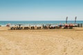 Vacationers in Arrabassada Beach, one of the famous golden sand beaches in the Spanish Costa Daurada