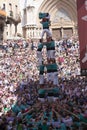 Tarragona, Spain, September 19, 2019 - Children climb to human castles tower top