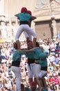 Tarragona, Spain, September 19, 2019 - Children on top of human castells tower