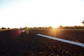 TARRED ROAD AT SUNSET