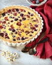 Tart with berries and sour cream fill on a gray background Royalty Free Stock Photo