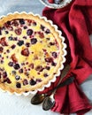 Tart with berries and sour cream fill on a gray background Royalty Free Stock Photo