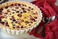 Tart with berries and sour cream fill on a gray background Royalty Free Stock Photo