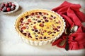 Tart with berries and sour cream fill on a gray background Royalty Free Stock Photo