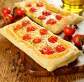 Tart with cheese and cherry tomatoes Royalty Free Stock Photo