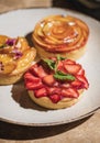 Tart desserts with fresh strawberry, peach and apricot fruits