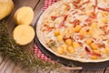 Tart with fried potato, raclette cheese and smoke flavour bacon. Royalty Free Stock Photo