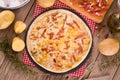 Tart with fried potato, raclette cheese and smoke flavour bacon. Royalty Free Stock Photo