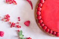 Tart, pie, cake with jellied and fresh raspberry on the light concrete background.