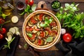 Tart with vegetables. Homemade savory tart with eggplant, zucchini, tomatoes, garlic, mozzarella cheese and fresh basil. Mediterra Royalty Free Stock Photo