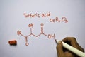 Tartacid Acid O4,H6,O3 molecule written on the white board. Structural chemical formula. Education concept