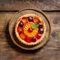 Tarte tatin with cherry and mint, upside down apple tart, traditional french apple pie with caramelized apples on wooden Royalty Free Stock Photo