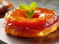 Tarte tatin, upside down apple tart decorated with mint leaves, traditional french apple pie with caramelized apples. Created with Royalty Free Stock Photo