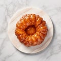 Tarte tatin, upside down apple tart on round plate on marble background, traditional french apple pie with caramelized apples, top