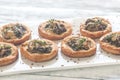 Tartelettes with shiitake mushrooms and cheese Royalty Free Stock Photo