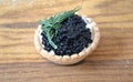 Tartlet with butter and black caviar