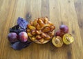 Tartlet of fresh plums and plums on a wooden Board.