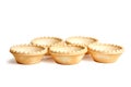 Tartlet shells isolated on white background. Empty mini tart shells for portable desserts Royalty Free Stock Photo