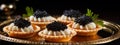 Tartlets with caviar on a plate. Selective focus.