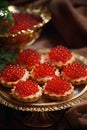 Tartlets with caviar on a plate. Selective focus.