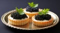 Tartlets with caviar on a plate. Selective focus.