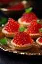 Tartlets with caviar on a plate. Selective focus.