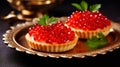 Tartlets with caviar on a plate. Selective focus.