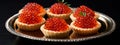 Tartlets with caviar on a plate. Selective focus.