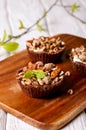 Tartlets with chocolate filling, cereal, nuts and mint