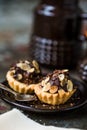 Tartlets with chocolate filling sprinkled with almonds Royalty Free Stock Photo