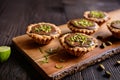 Tartlets with chocolate, pistachios and lime peel Royalty Free Stock Photo