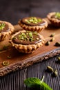 Tartlets with chocolate, pistachios and lime peel Royalty Free Stock Photo