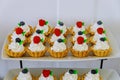 Tartlets mini dessert with fresh fruits on tiered stand Royalty Free Stock Photo