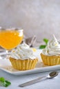 Tartlets with orange jam and protein cream decorated with orange zest on a white plate Royalty Free Stock Photo