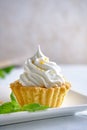 Tartlets with orange jam and protein cream decorated with orange zest on a white plate Royalty Free Stock Photo