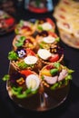 tartlets with pate and salad garnished with flowers. Delicious appetizers.