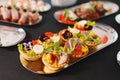 tartlets with pate and salad garnished with flowers. Delicious appetizers.