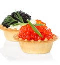 Tartlets with red and black caviar isolated on white Royalty Free Stock Photo