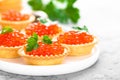 Tartlets with red salmon fish caviar, salmon caviar. Caviar