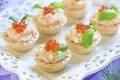 Tartlets with seafood salad, red caviar and basil Royalty Free Stock Photo