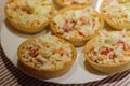 tartlets with snack on white plate