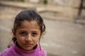 Portrait of a pretty Syrian Girl in a poor neighborhood