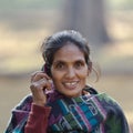 Taru ethnic woman talking with mobil phone in Nepal