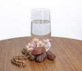 tasbeh,dates and glass of water, month of ramadan, flowering branch