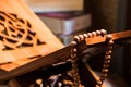 Tasbih or Islamic prayer beads on rehal or Quran wooden book stand