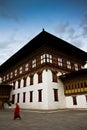 The Tashi Chho Dzong Fortress with blue skies and monk, Thimpu, Bhutan