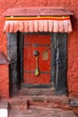Red door in Tashilhunpo Monastery Tibet, China Royalty Free Stock Photo